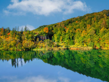 Breathtaking colorful autumn landscape with spectacular lake and waterfalls in plitvice lakes.
