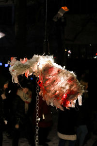 Close-up of christmas decoration hanging at night