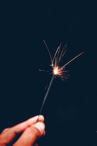 Low angle view of firework display at night