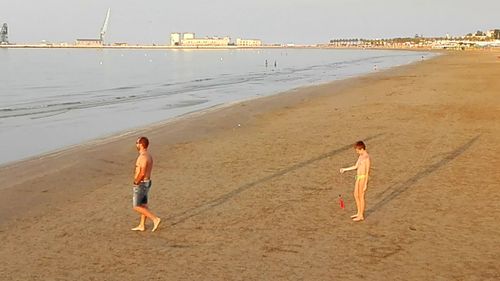 Full length of woman standing on beach