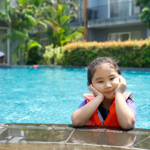 Portrait of cute girl in swimming pool