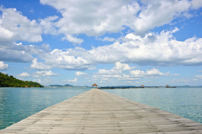 Pier over sea against sky