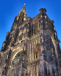 Low angle view of cathedral against blue sky