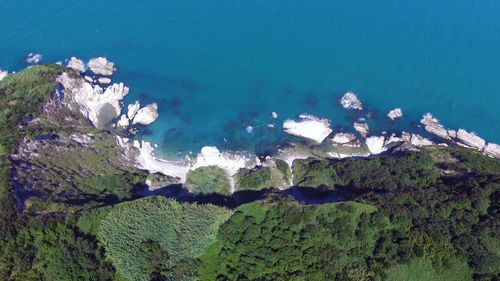 High angle view of rocks by sea