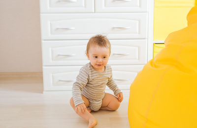 Full length of cute baby at home