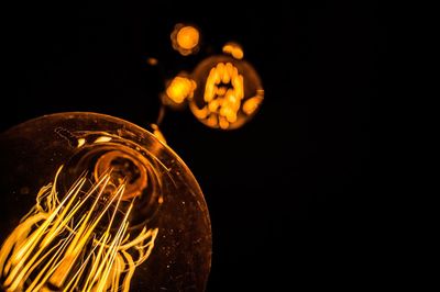 Close-up of illuminated light bulb