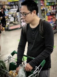 Mid adult man riding motorcycle at store