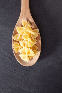 Directly above shot of farfalle pastas in spoon