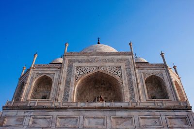 Low angle view of built structure against blue sky