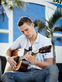 Young man playing guitar