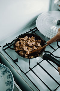 High angle view of person preparing food in kitchen