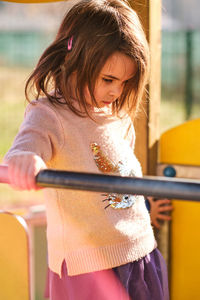 Close-up of girl holding camera