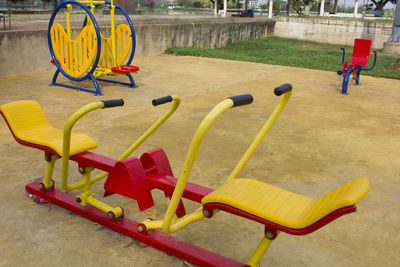 High angle view of empty chairs in playground