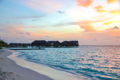 Scenic view of sea against sky at sunset