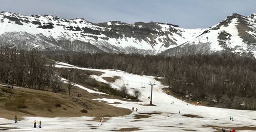 Scenic view of snow covered mountains against sky