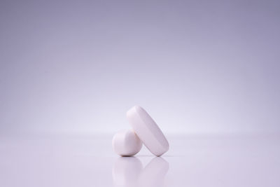 Close-up of white table against gray background