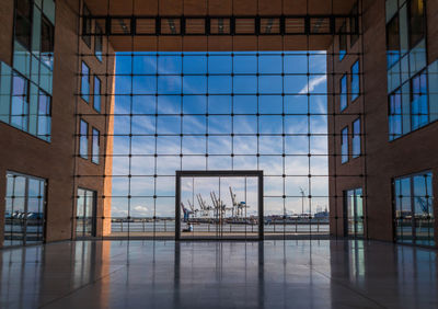 Reflection of building on glass window