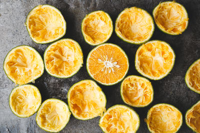 Directly above shot of orange fruits with peel on marble