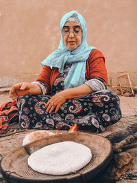 A woman preparing bread in the traditional way