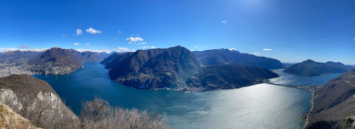 Panoramic view of mountains against blue sky