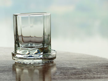 Close-up of beer glass on table