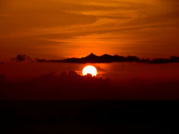 Scenic view of dramatic sky during sunset