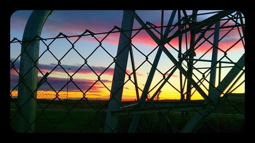 Chainlink fence at sunset