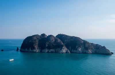 Scenic view of sea against blue sky