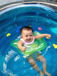 Portrait of baby boy playing in pool