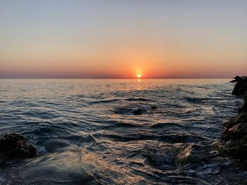 Scenic view of sea against sky during sunset