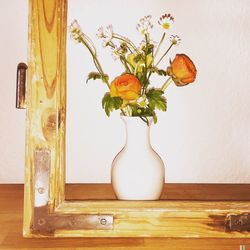 Close-up of flower vase on table