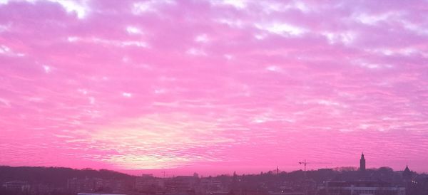 Panoramic view of cityscape against sky during sunset