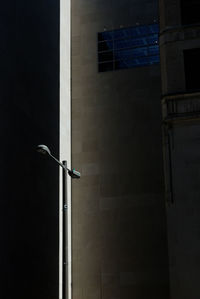 Lamp post against built structure