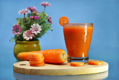 Close-up of orange juice on table