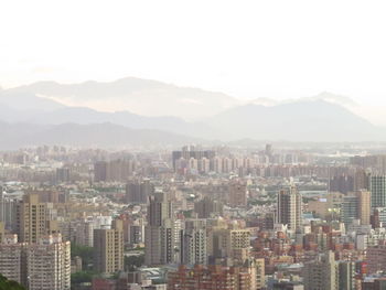 High angle view of buildings in city against sky