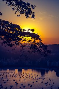 Scenic view of lake against sky during sunset