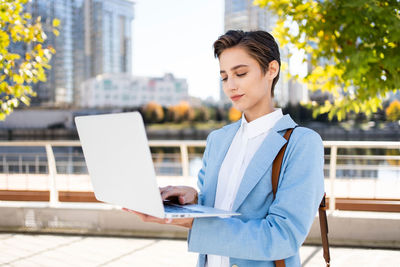 Portrait of young businesswoman using digital tablet