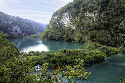 Scenic view of lake and mountains against sky, plitvice, croatia