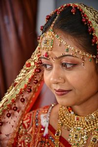 Portrait of beautiful young bride at home