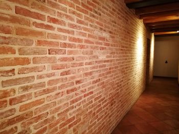 View of illuminated brick wall