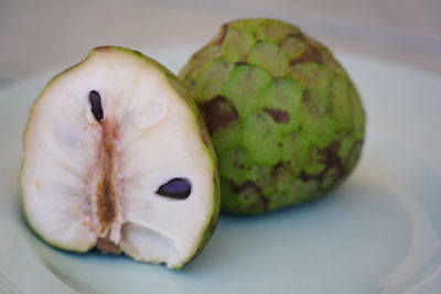 Close-up of fruits in plate on table