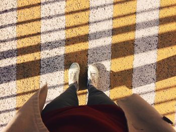 Low section of man standing on floor