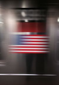 Close-up of red flags against blurred background