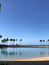 Scenic view of sea against clear blue sky