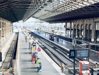 Blurred motion of people waiting at railroad station