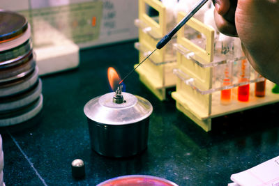 Close-up of person hands experimenting in laboratory