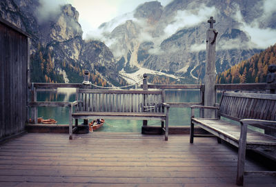 View of dog on railing against mountain