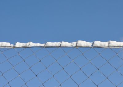 Scenic view of snow against clear blue sky