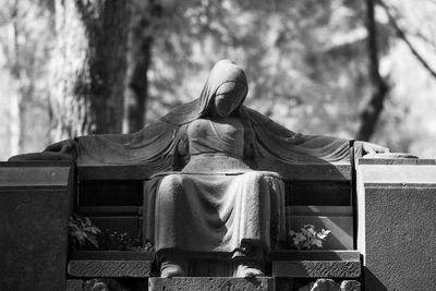 Human sculpture at graveyard