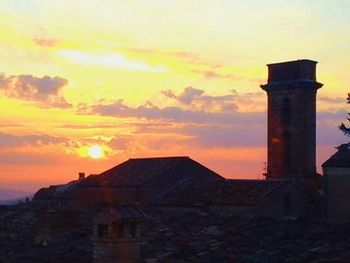 Built structure against sky at sunset